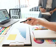 Image of a computer on a desk with colour graphs that assist with Colour Analysis by Image Consultants