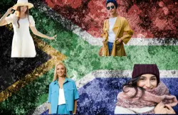 image of South Africa flag with 3 woman infront of it. It is depicting clothing for the different seasons